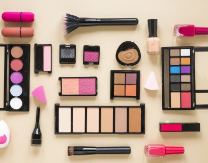 various-cosmetics-types-scattered-beige-table