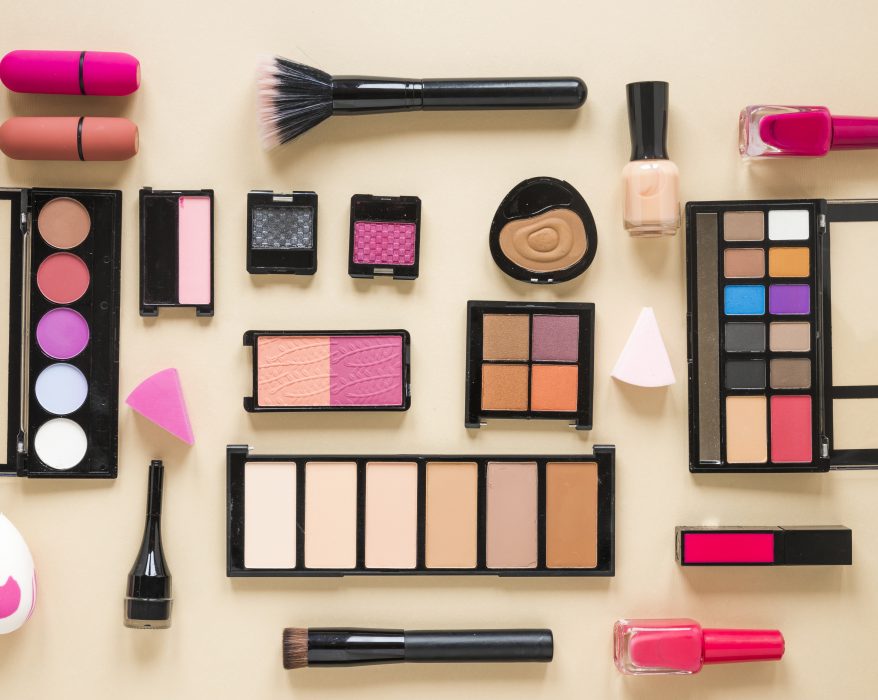 various-cosmetics-types-scattered-beige-table