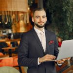 man working with laptop in a event