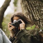 young women taking photo of nature
